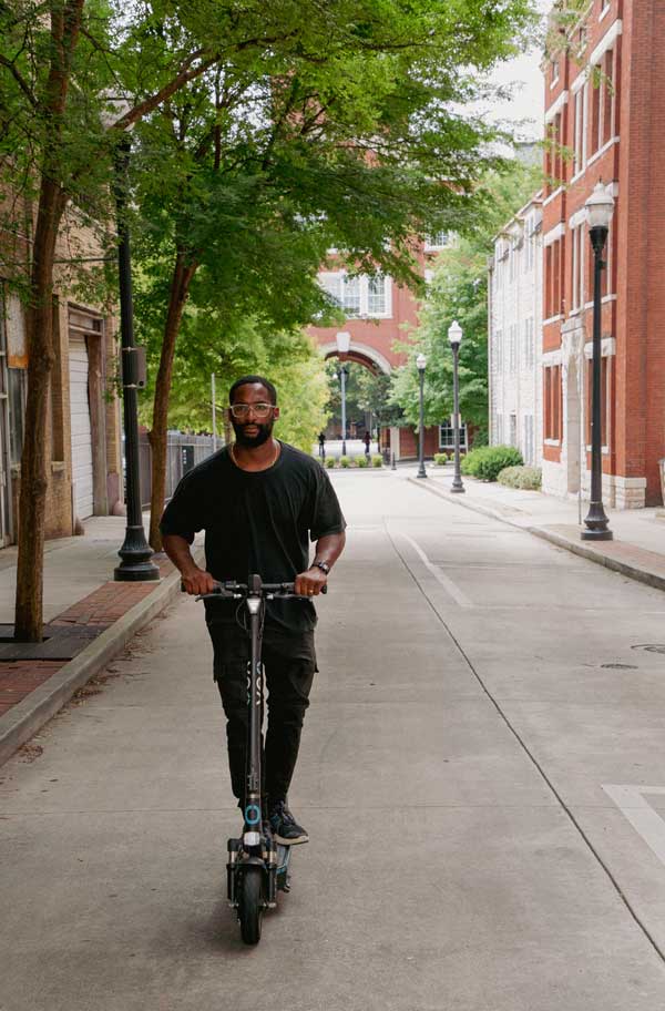 umo man riding scooter