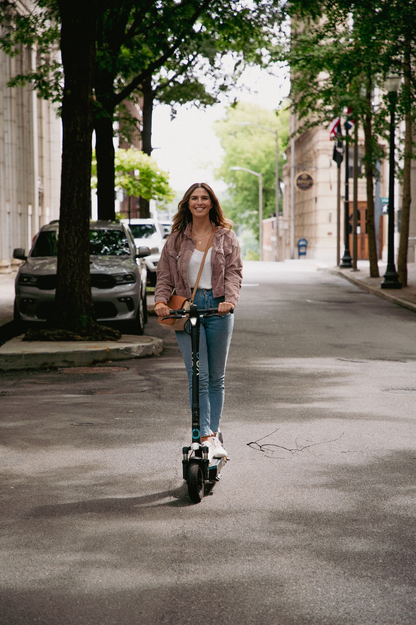 Women on scooter smiling