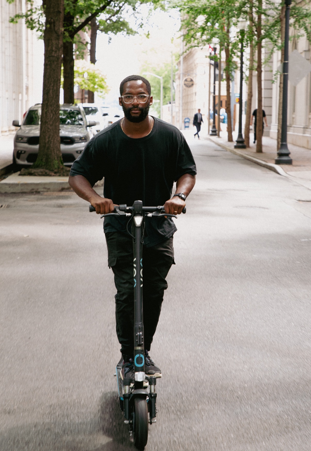 Young man riding a scooter using Umo